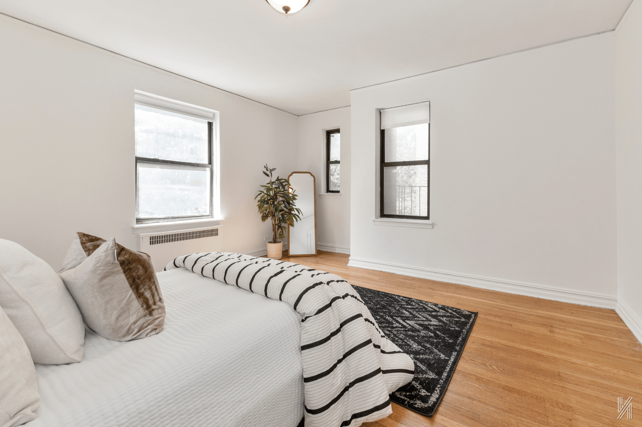 35-35 75th Street, Unit 428 Queens, NY 11372 - Photo 15 of 21 a bedroom with furniture and a window