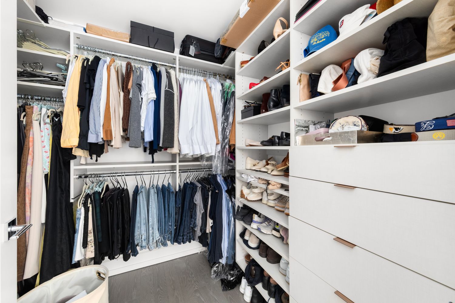 70 Charlton Street, Unit 19D Manhattan, NY 10014 - Photo 8 of 14 a view of walk in closet with clothes and shoes