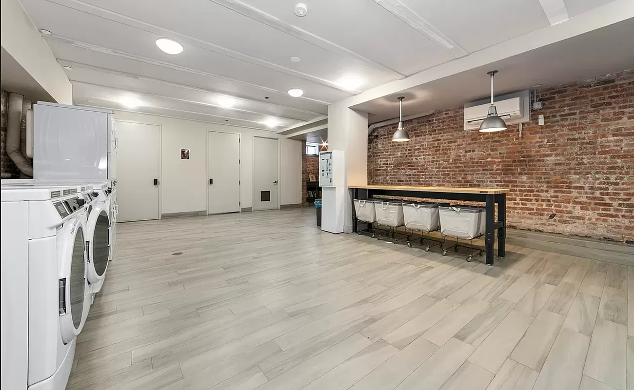 180 Bainbridge Street, Unit 106 Brooklyn, NY 11233 - Photo 13 of 22 a view of livingroom with furniture and a fireplace