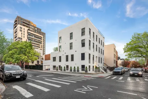 a view of a street in front of a building