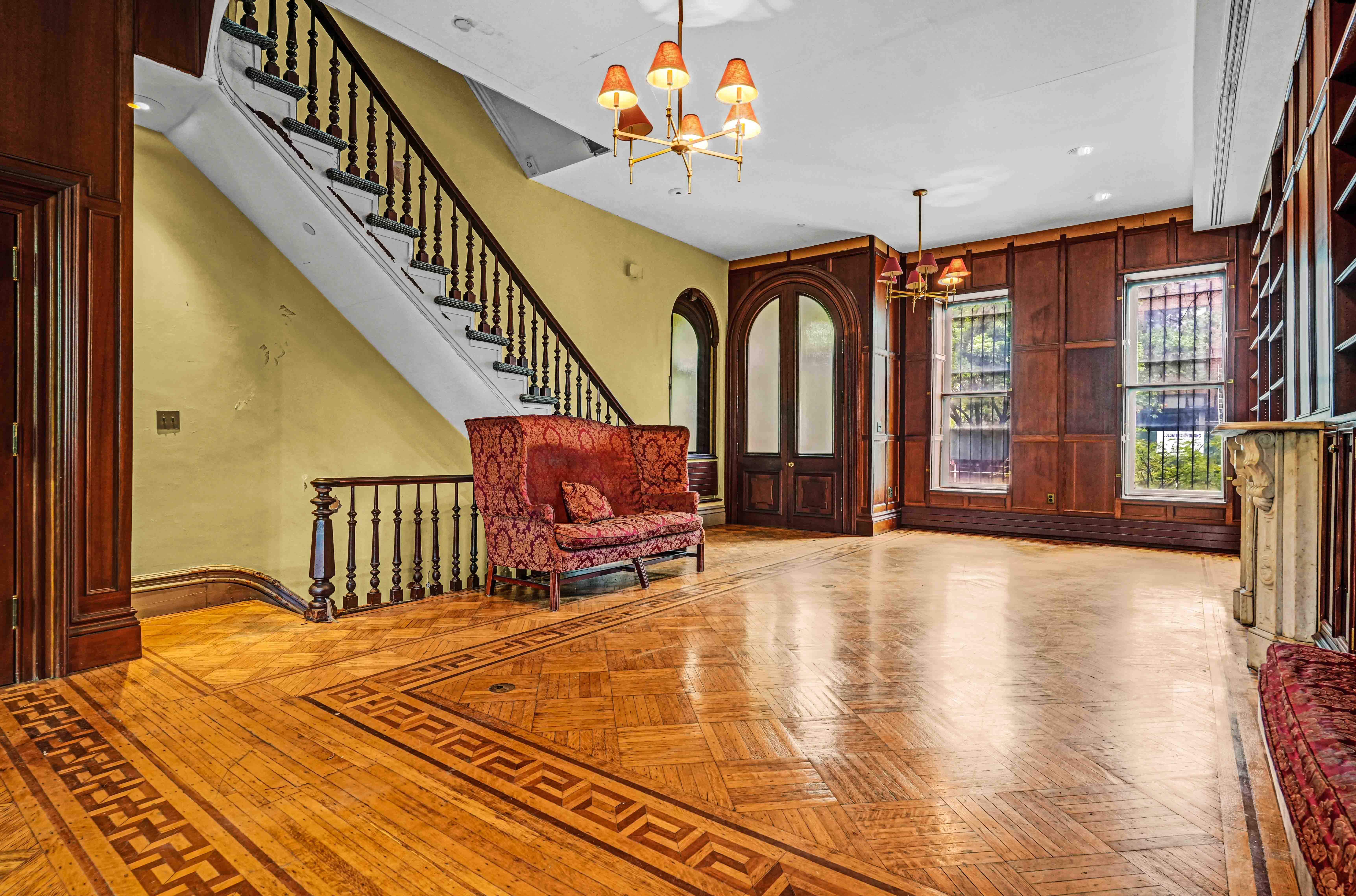 300 Lafayette Avenue Brooklyn, NY 11238 - Photo 9 of 17 a spacious bedroom with a bed and a chandelier