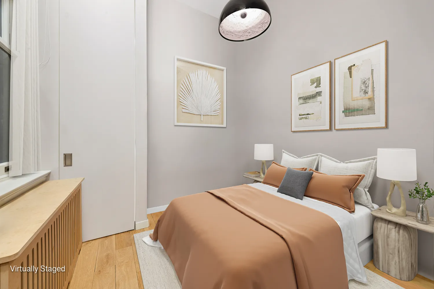 a bedroom with a bed and cabinets