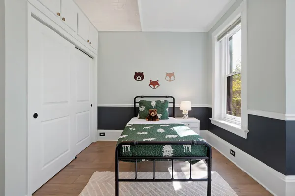 a bedroom with a bed and window