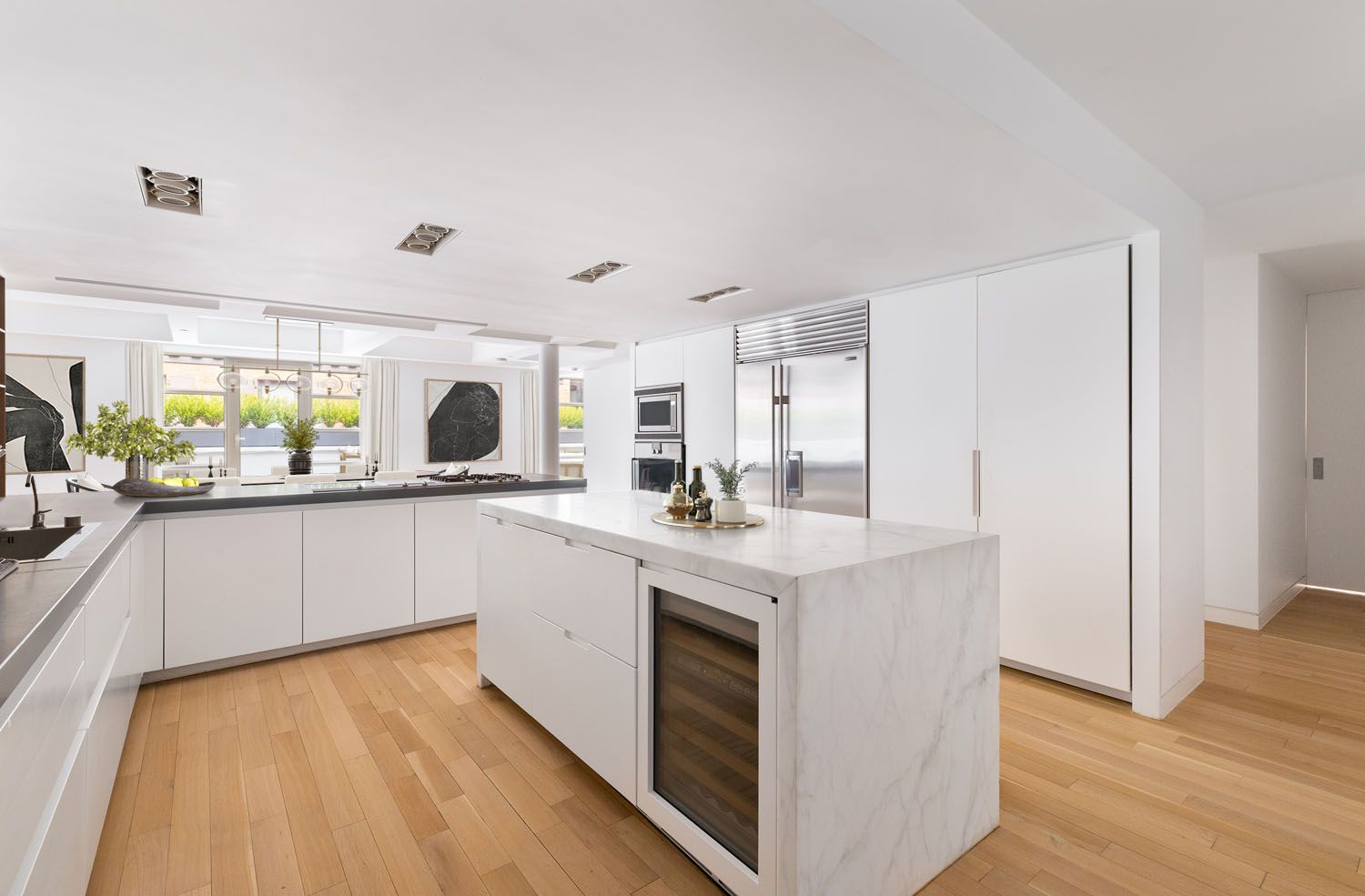 60 Collister Street, Unit 4A Manhattan, NY 10013 - Photo 6 of 21 a kitchen with a sink and white cabinets with wooden floor