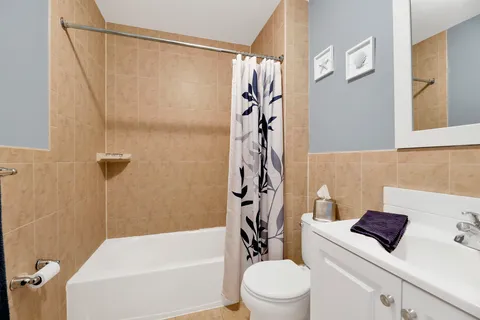 a bathroom with a sink a toilet and a bathtub