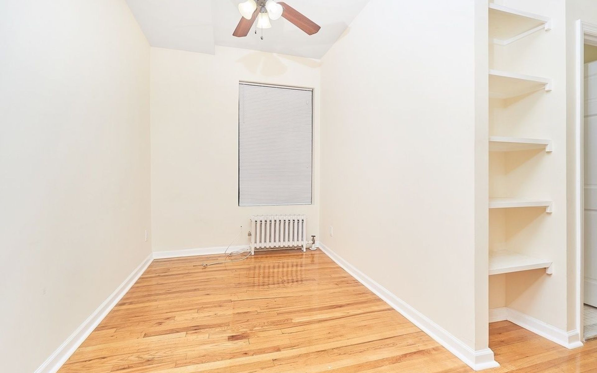 270 East 78th Street, Unit 17 Manhattan, NY 10075 - Photo 2 of 6 a view of a room with wooden floor and a window