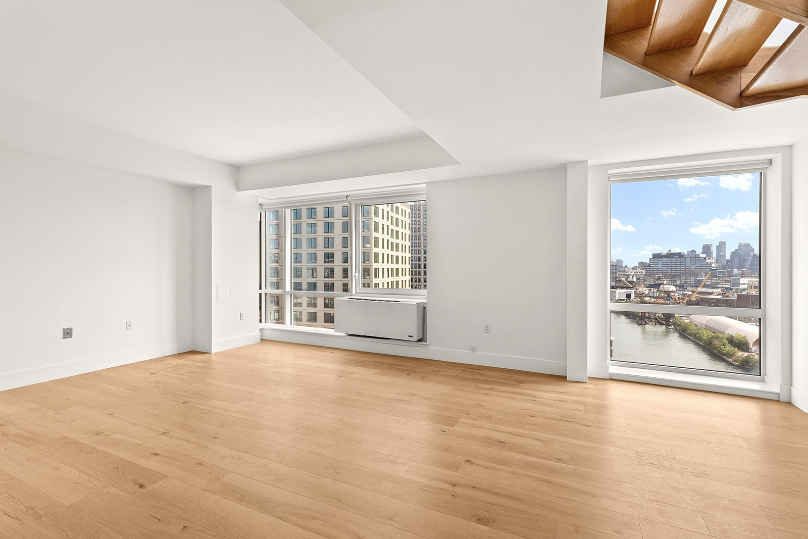 446 Kent Avenue, Unit PHC Brooklyn, NY 11249 - Photo 2 of 22 a view of an empty room with a window