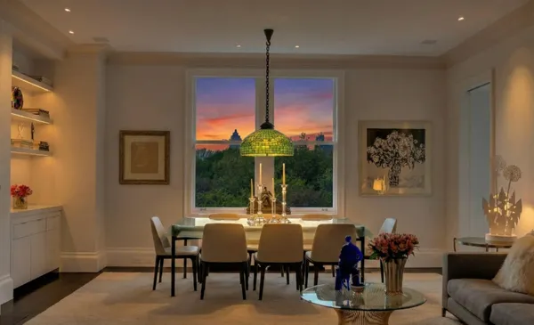a view of a dining room with furniture and chandelier