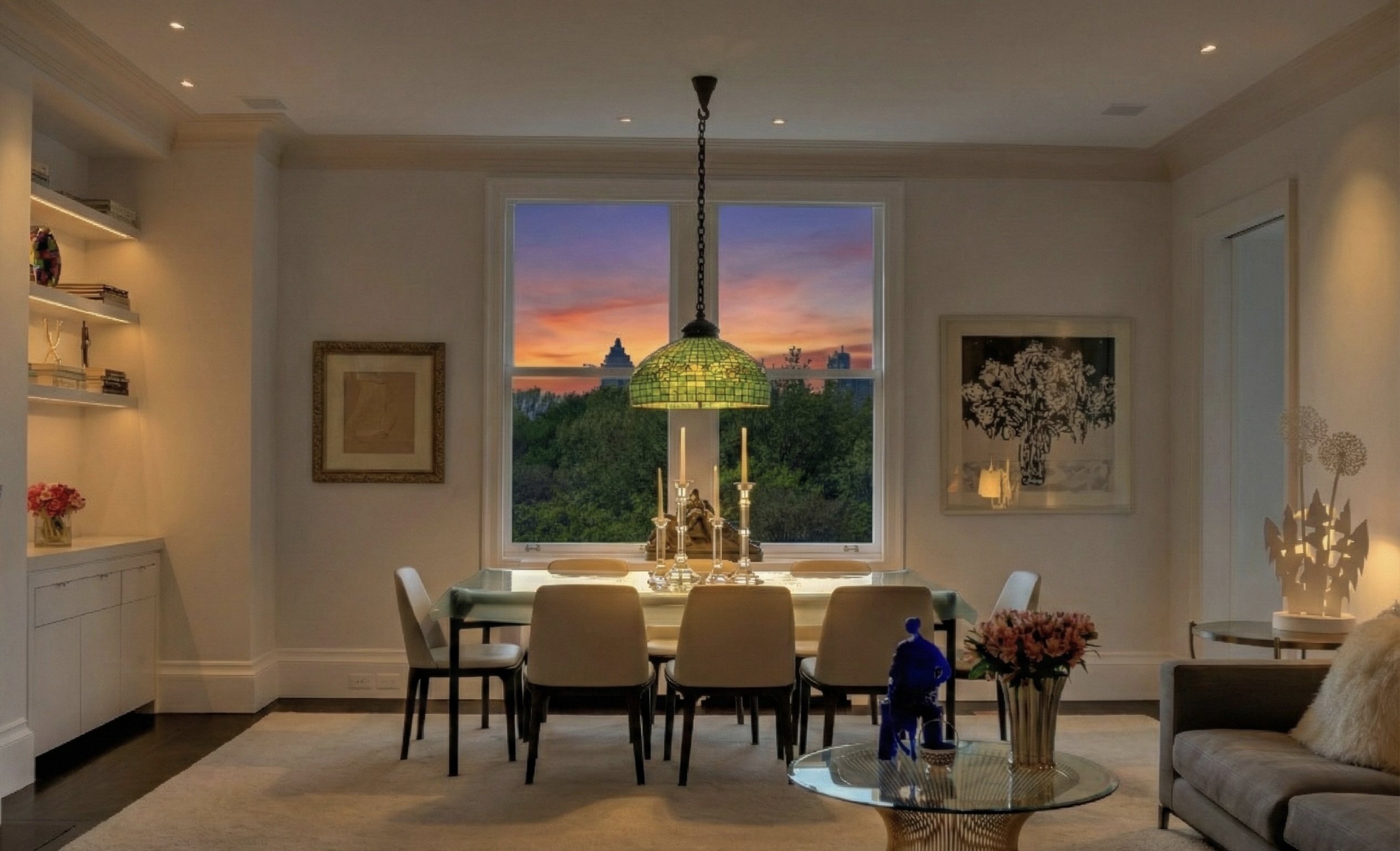a view of a dining room with furniture and chandelier
