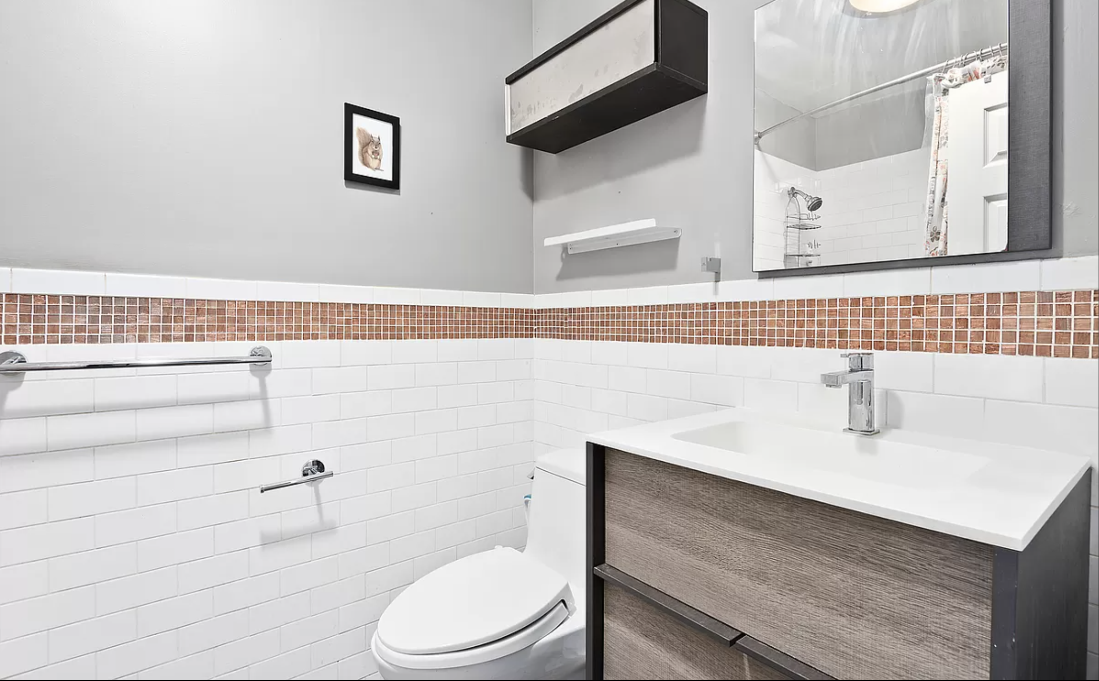 706 Sackett Street, Unit 2 Brooklyn, NY 11217 - Photo 5 of 7 a bathroom with a sink a toilet and mirror