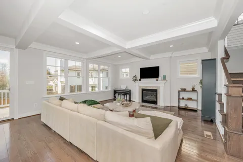 a kitchen with a sink a counter top space stainless steel appliances and cabinets