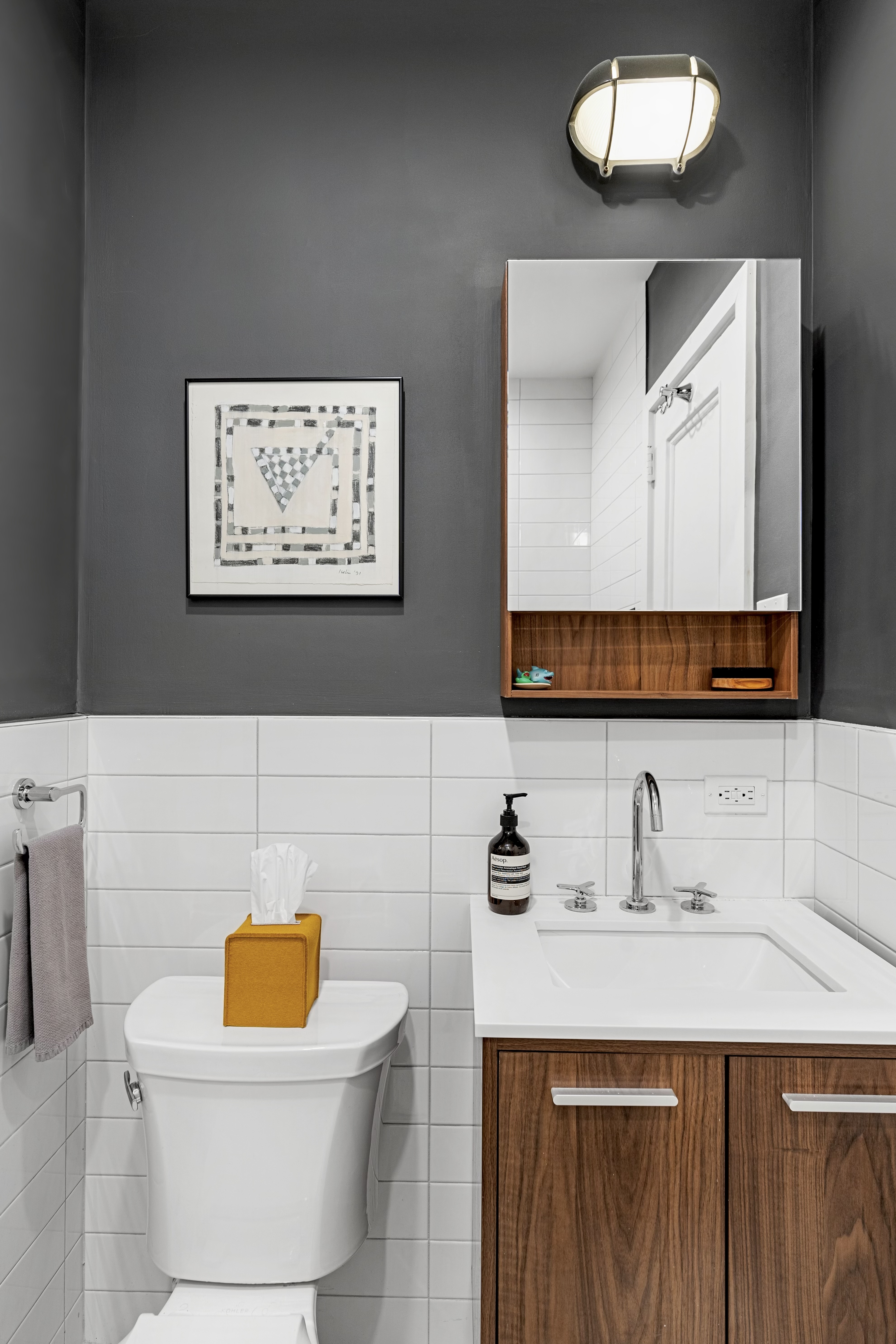 40 West 67th Street, Unit 1A Manhattan, NY 10023 - Photo 11 of 17 a bathroom with a sink and a mirror