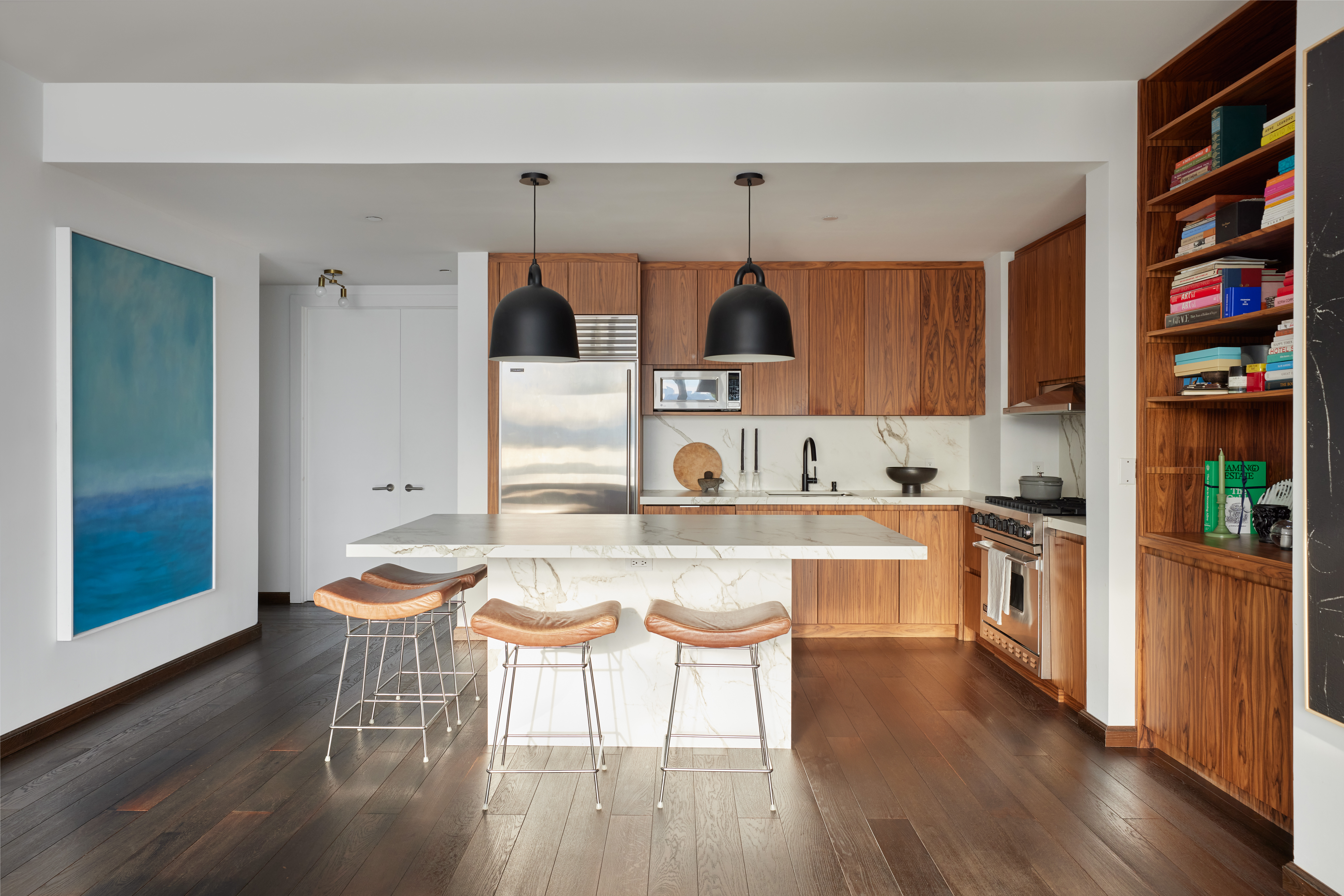 505 Greenwich Street, Unit 14A Manhattan, NY 10013 - Photo 5 of 20 a kitchen with stainless steel appliances a stove a sink dishwasher and cabinets with wooden floor