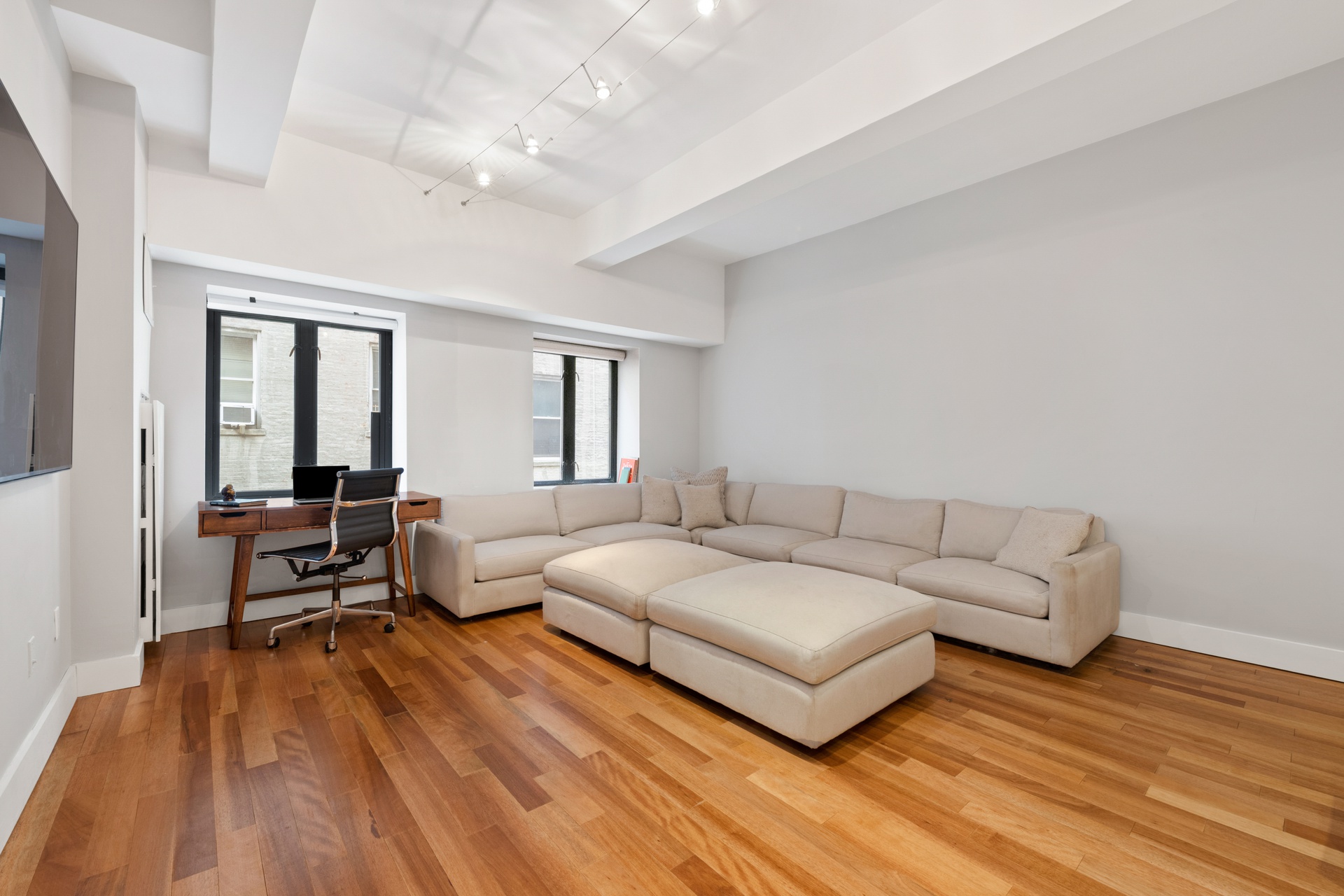 135 West 70th Street, Unit 4A Manhattan, NY 10023 - Photo 2 of 7 a living room with furniture and a wooden floor