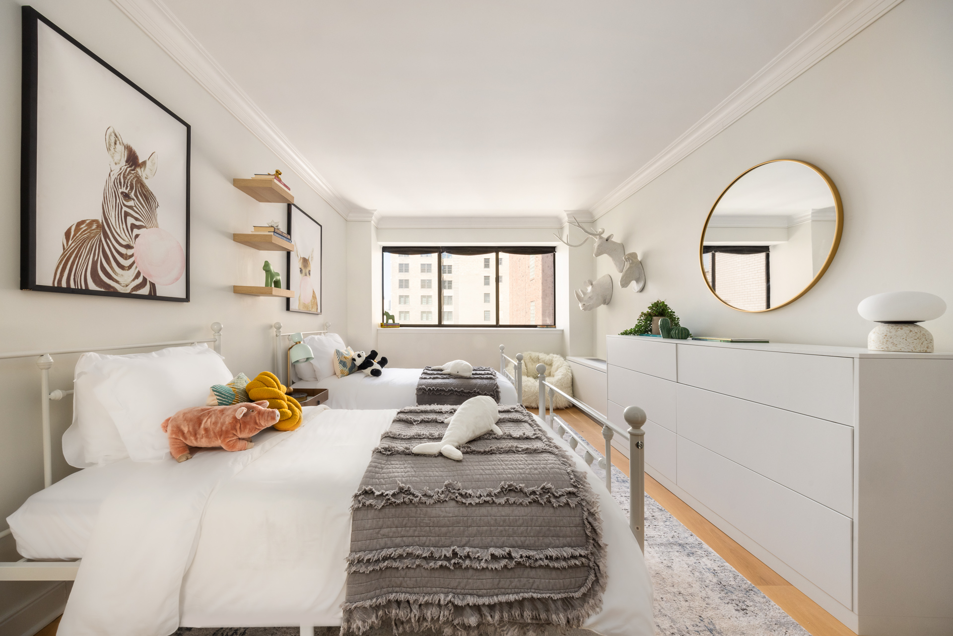 32 East 76th Street, Unit 805 Manhattan, NY 10021 - Photo 12 of 15 a bedroom with a bed mirror and window