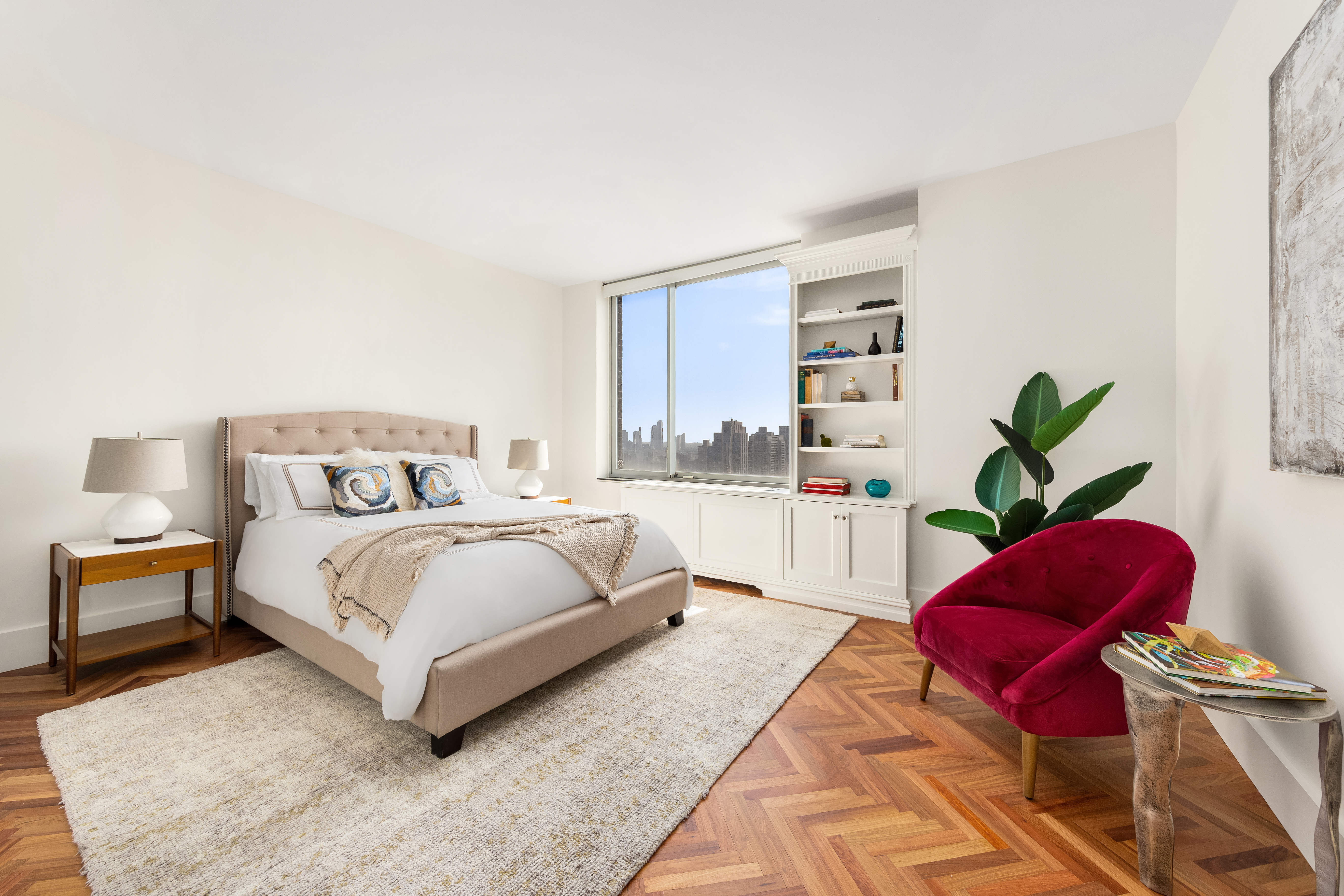 360 East 88th Street, Unit 31C Manhattan, NY 10128 - Photo 12 of 24 a bedroom with a large bed and a couch