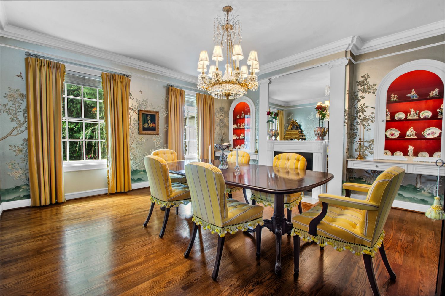 a view of a dining room with furniture and chandelier