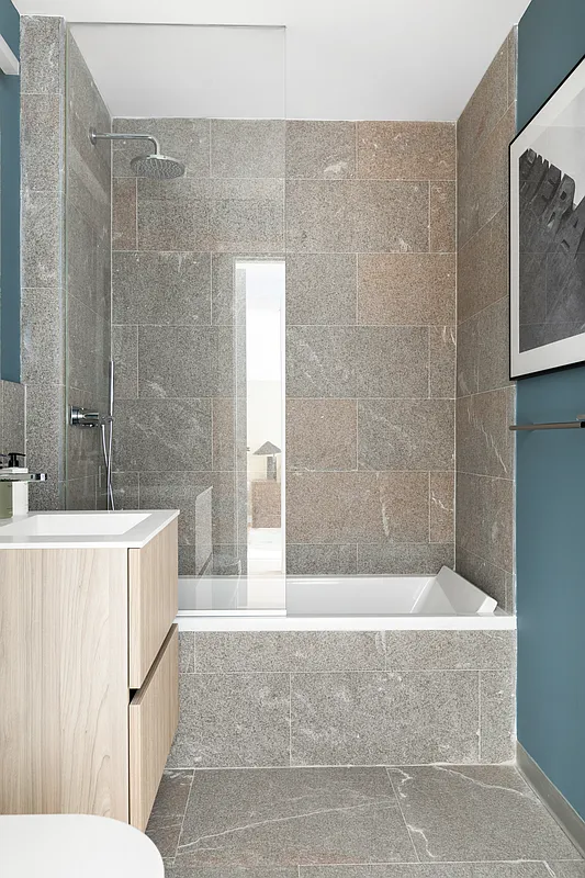 139 East 23rd Street, Unit 7 Manhattan, NY 10010 - Photo 13 of 17 a bathroom with a bathtub and shower