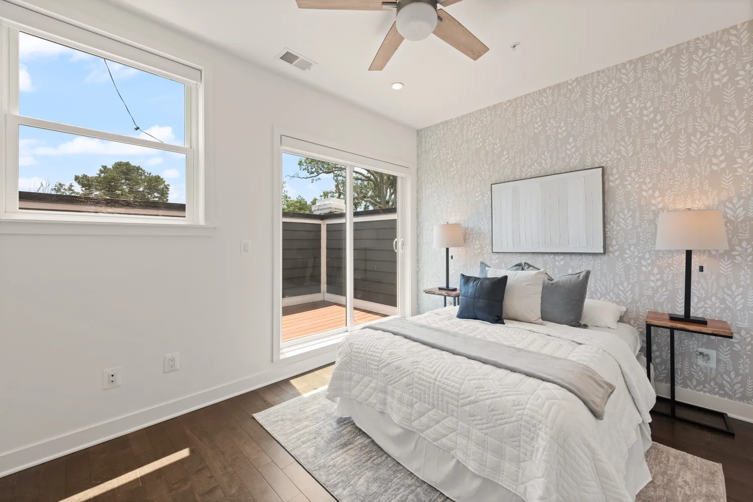 a bedroom with a large bed and a window