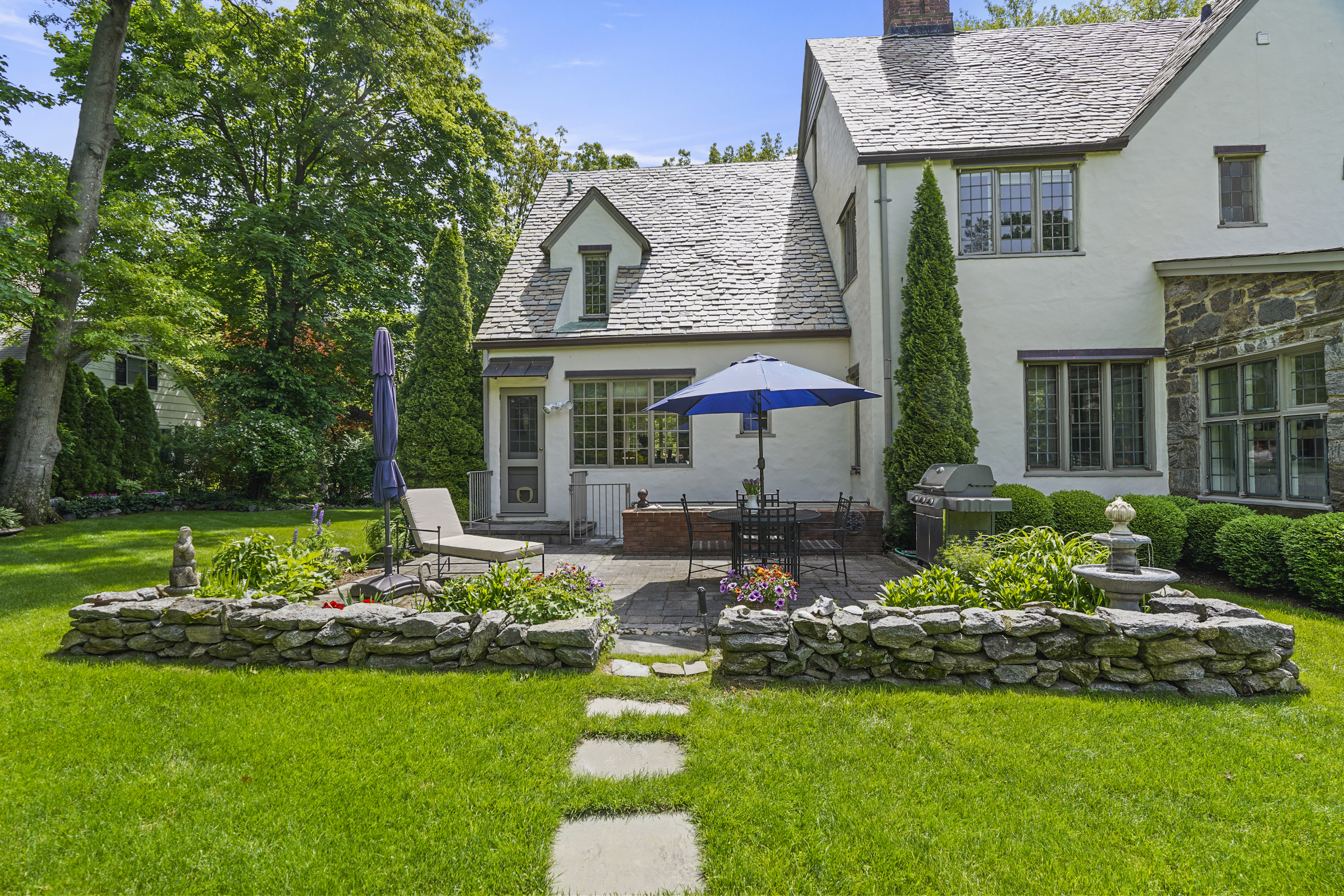 19 Avon Road Larchmont, NY 10538 - Photo 24 of 35 a view of a house with backyard and sitting area