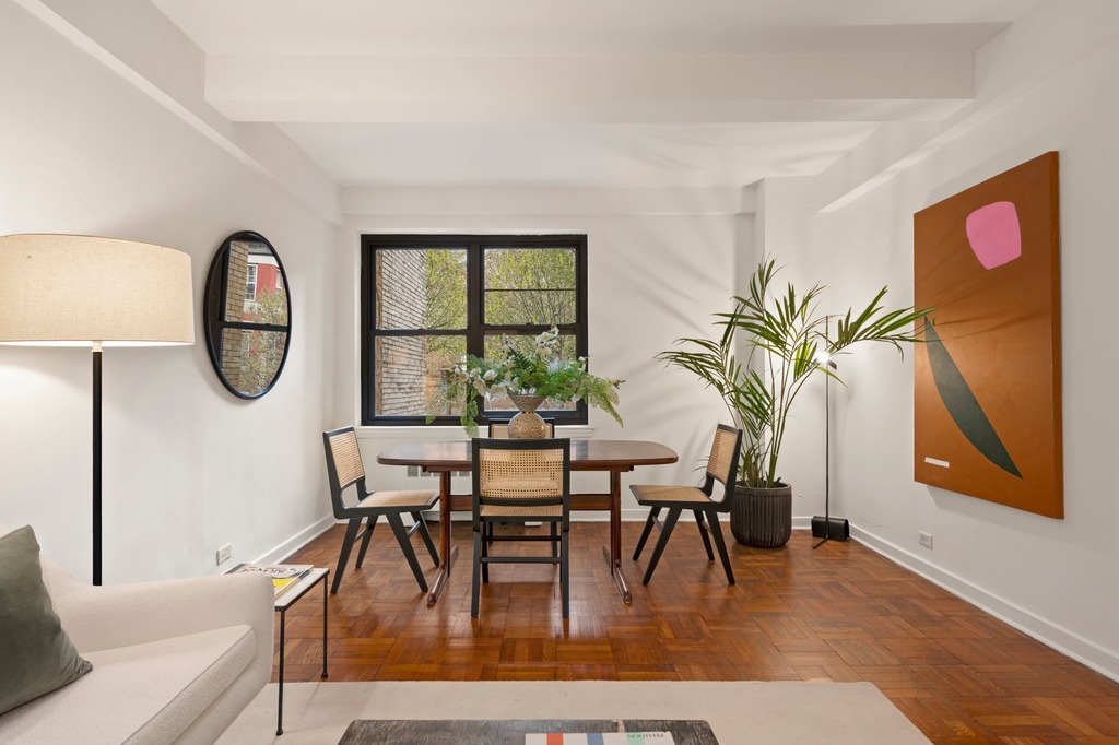 251 West 74th Street, Unit 3B Manhattan, NY 10023 - Photo 2 of 7 a view of a dining room with furniture and a potted plant