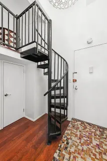 a view of entryway with wooden floor