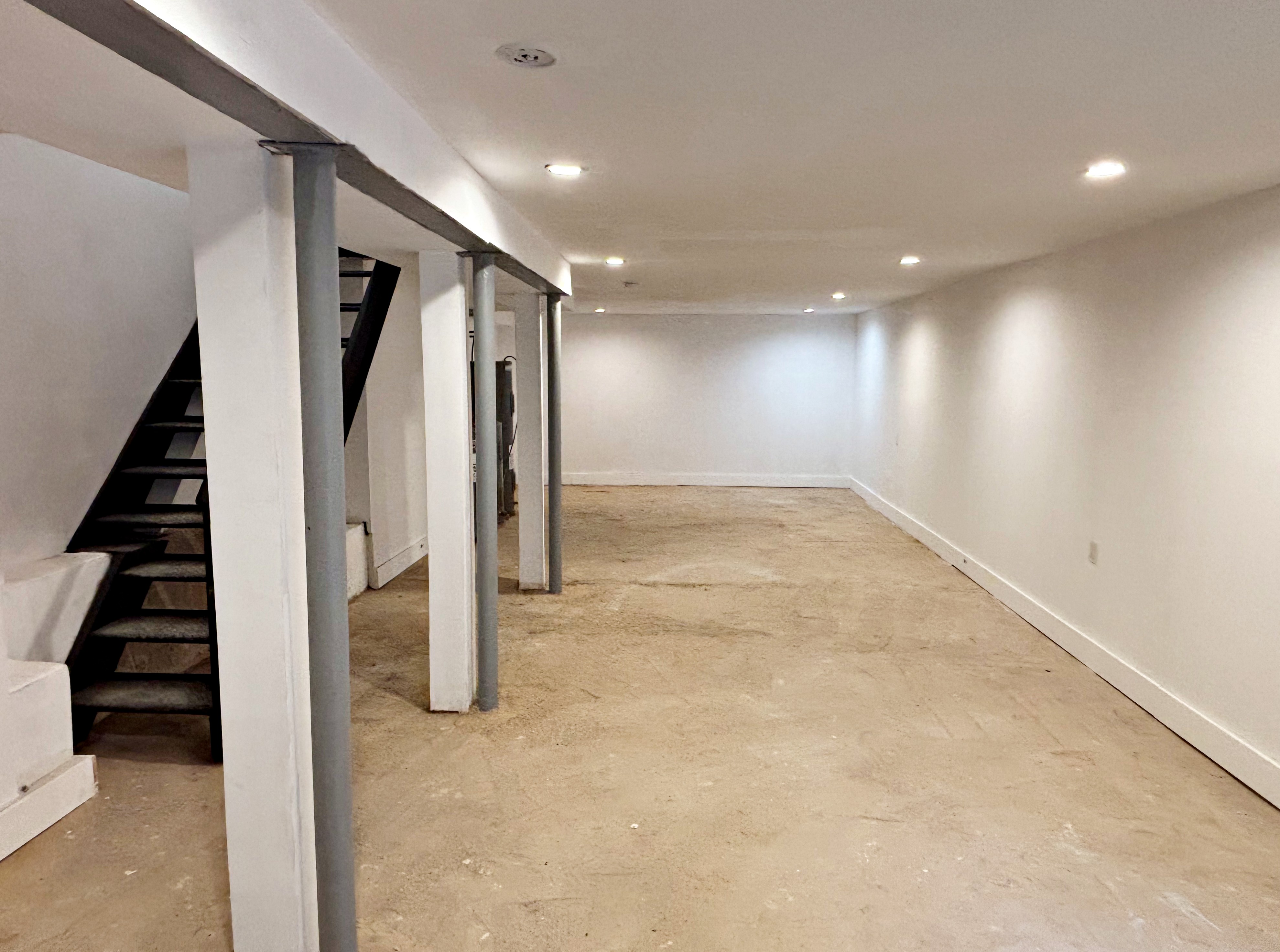 385 Nostrand Avenue, Unit Undisclosed Brooklyn, NY 11216 - Photo 11 of 27 a view of a hallway with staircase