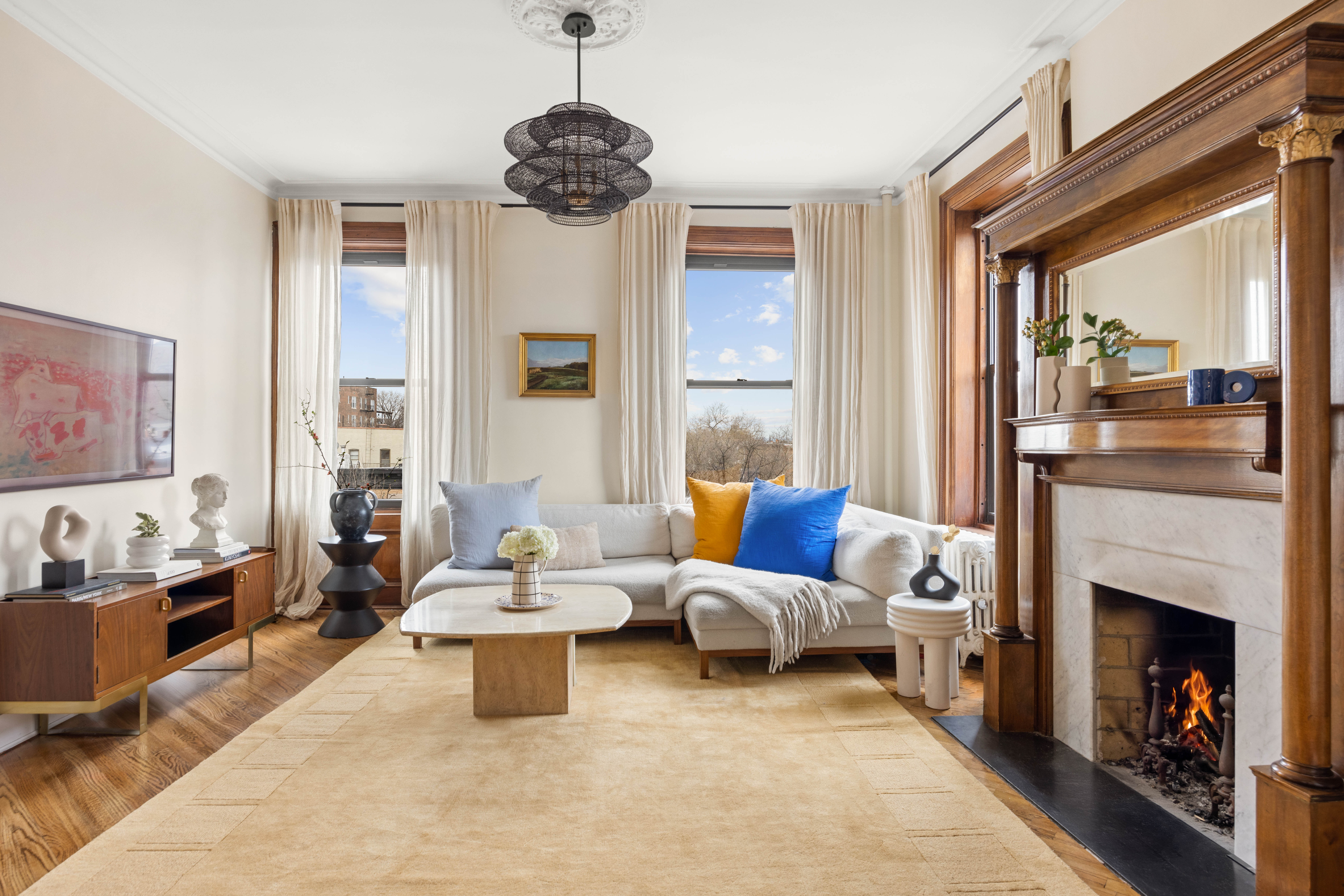 a living room with furniture and a fireplace