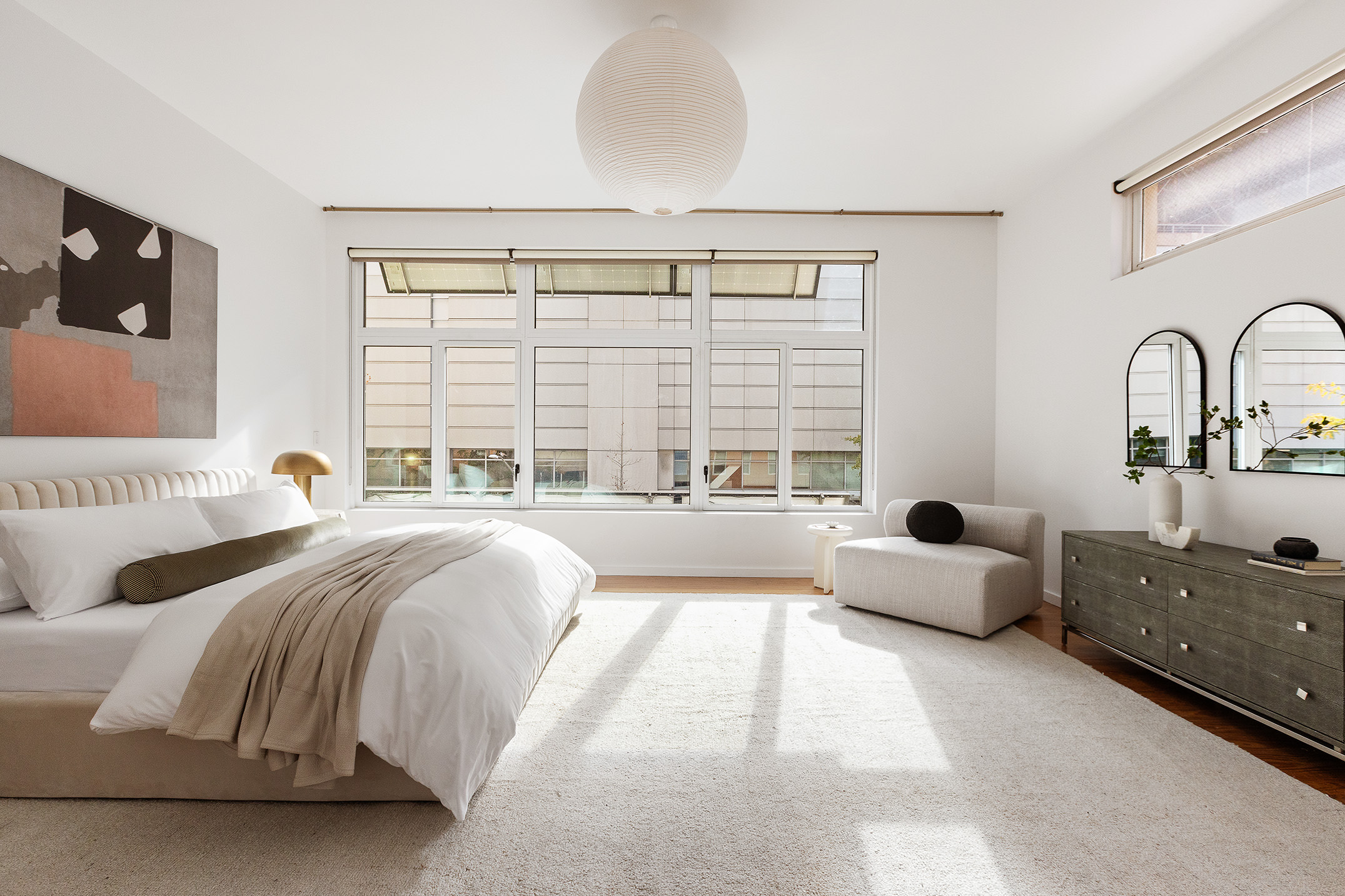 345 West 54th Street Manhattan, NY 10019 - Photo 8 of 22 a spacious bedroom with a bed and a large window