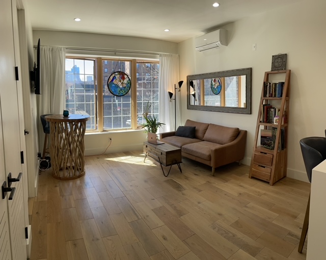 85 Carlton Avenue, Unit 2F Brooklyn, NY 11205 - Photo 1 of 7 a living room with furniture and a window