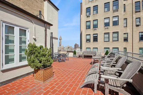a view of a chairs and table in the patio