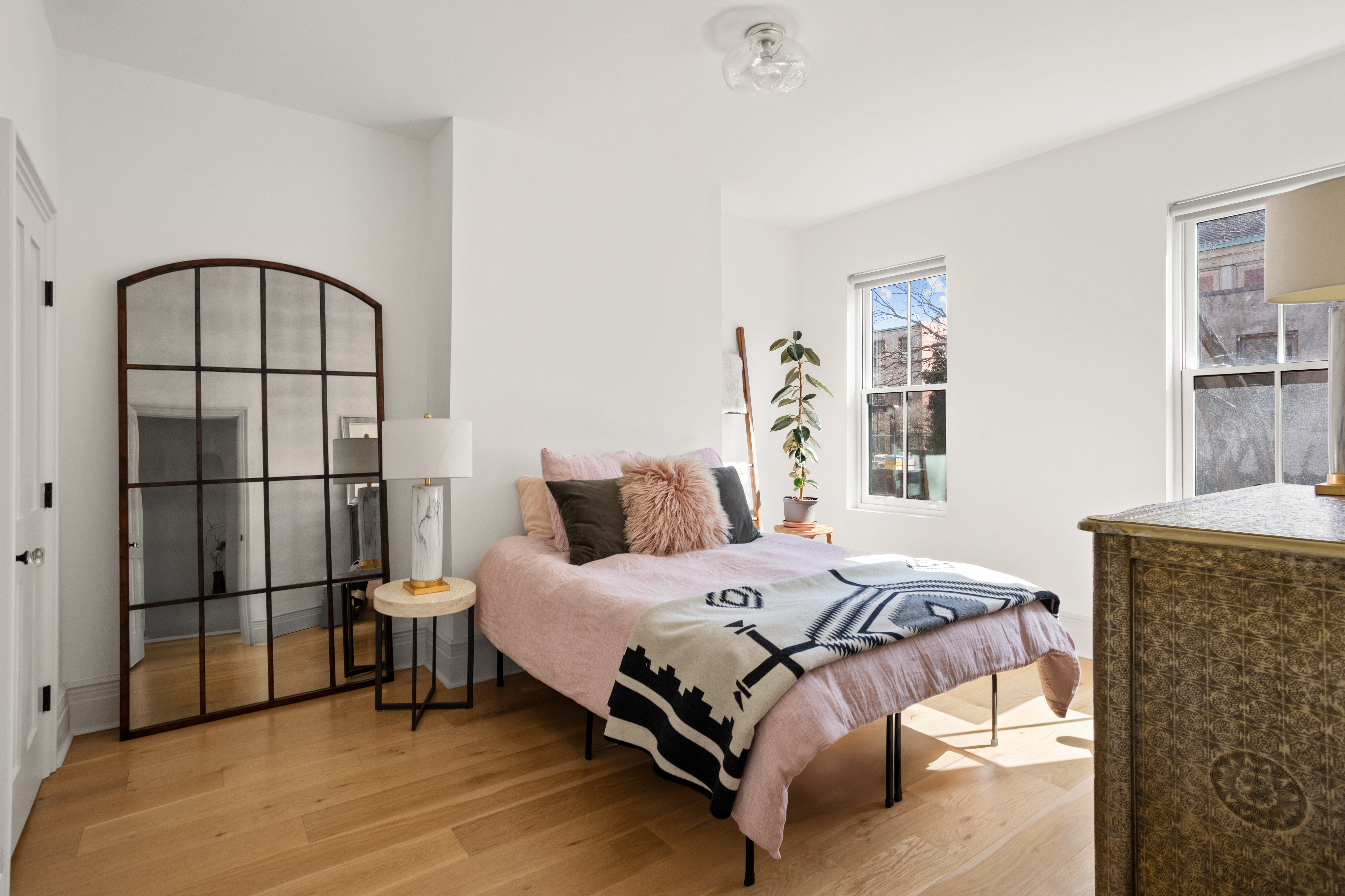 146 1/2 Java Street Brooklyn, NY 11222 - Photo 8 of 23 a bedroom with a bed and a window