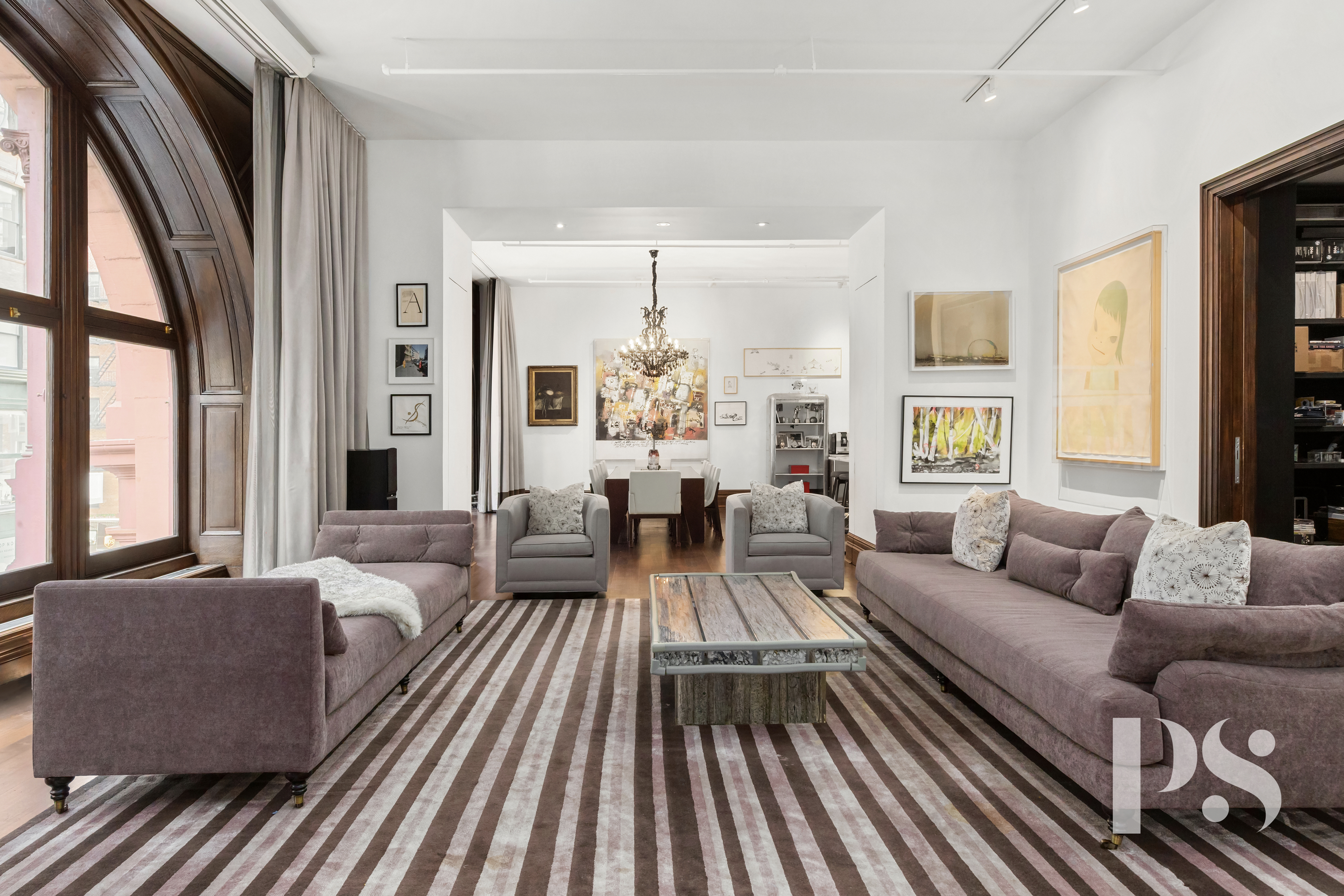 71-73 Bleecker Street, Unit 2E Manhattan, NY 10012 - Photo 2 of 18 a living room with furniture fireplace and a large window