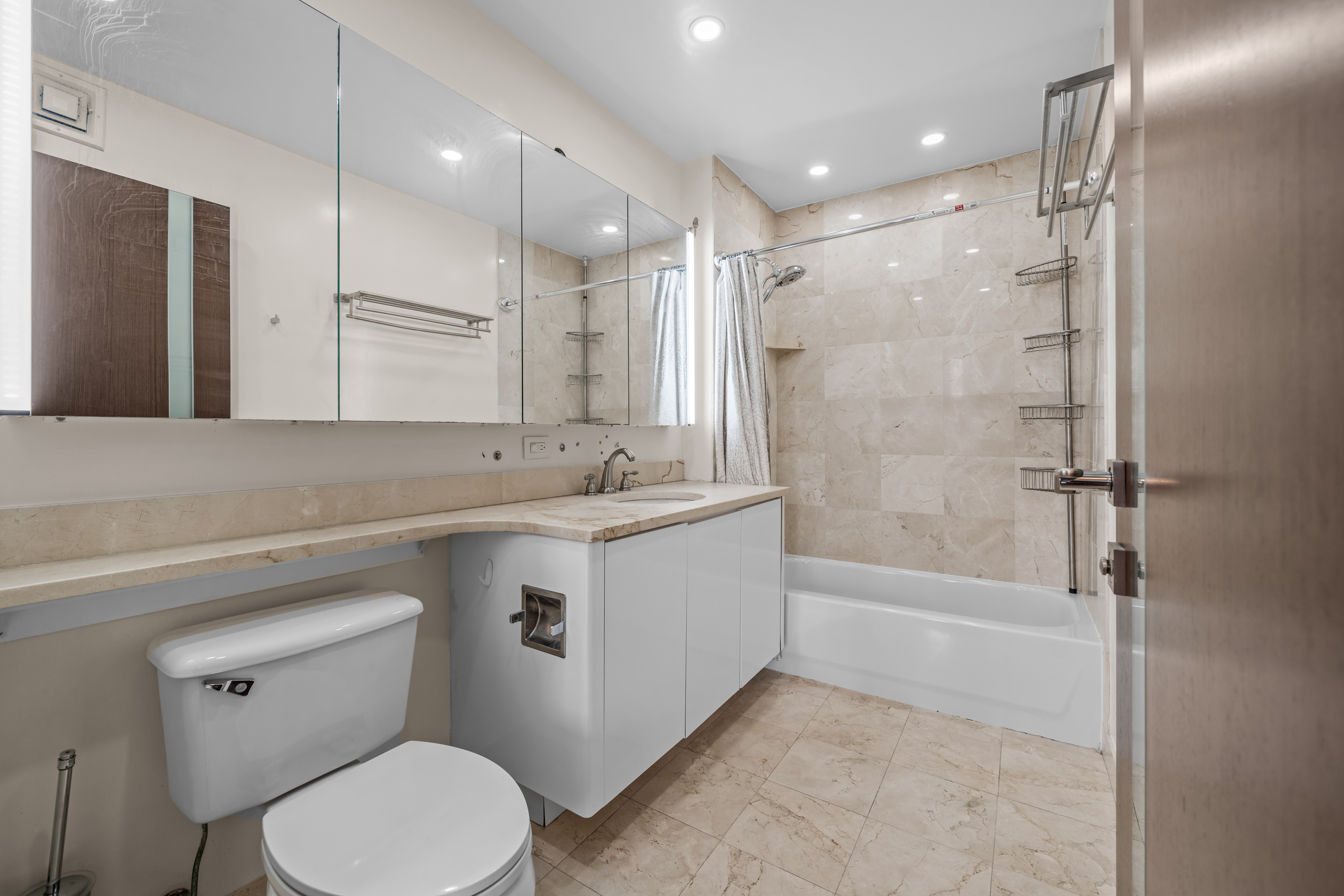 105 Oceana Drive East, Unit PH1D Brooklyn, NY 11235 - Photo 19 of 27 a bathroom with a sink a toilet and shower