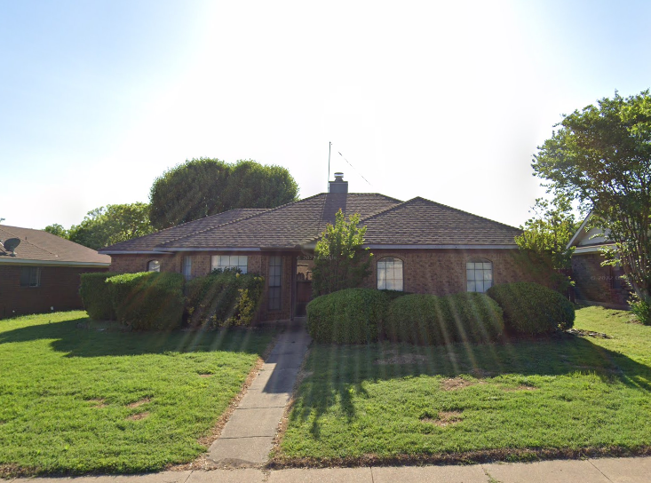 a front view of house with yard
