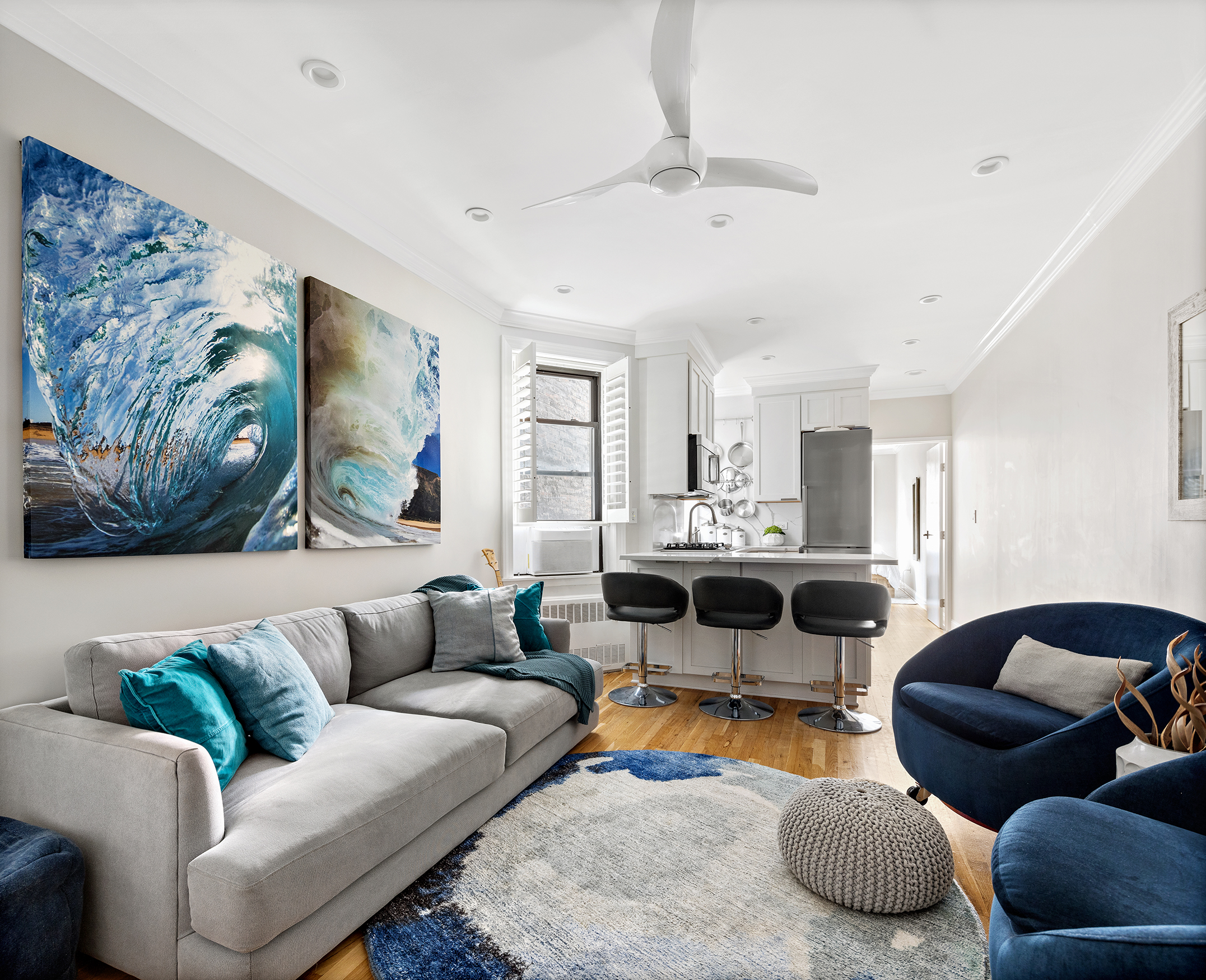 448 East 84th Street, Unit 3C Manhattan, NY 10028 - Photo 1 of 8 a living room with furniture and a large window