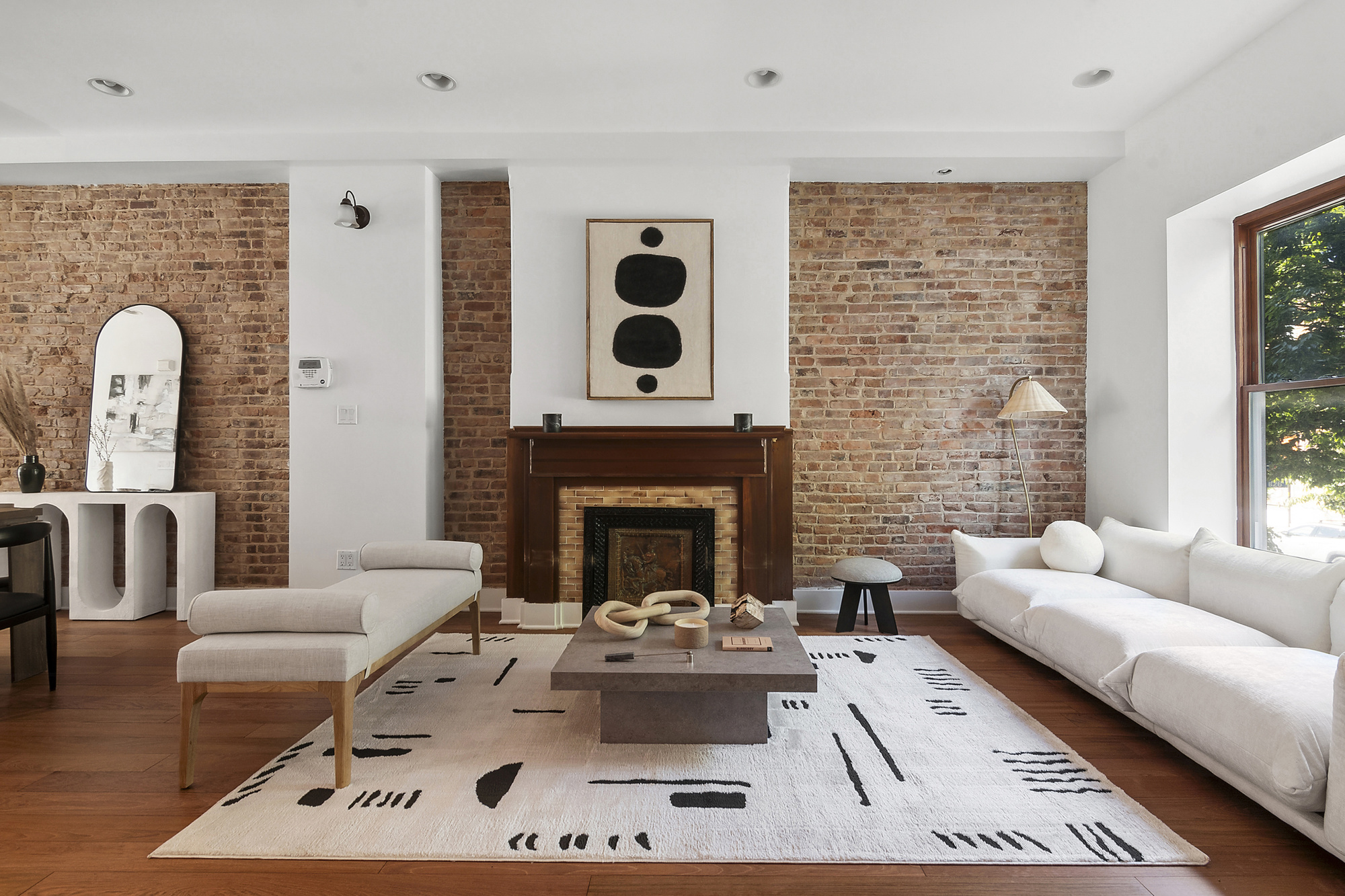 698 Halsey Street Brooklyn, NY 11233 - Photo 2 of 13 a living room with furniture and a fireplace