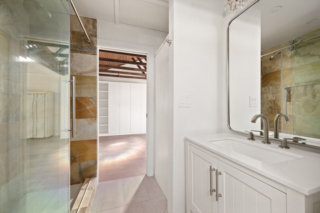 4416 Stearn's Lane Austin, TX 78735 - Photo 25 of 32 a bathroom with a sink and a mirror