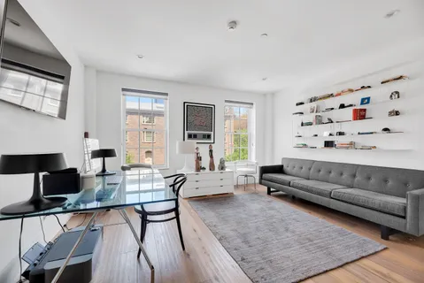 a living room with furniture window and flat screen tv
