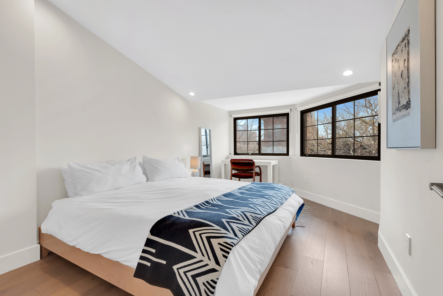 541 Madison Street, Unit 4 Brooklyn, NY 11221 - Photo 6 of 9 a bedroom with a large bed and a window