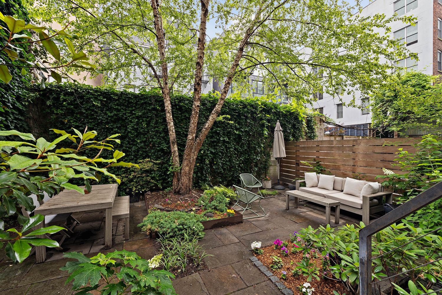 a view of a backyard with sitting area