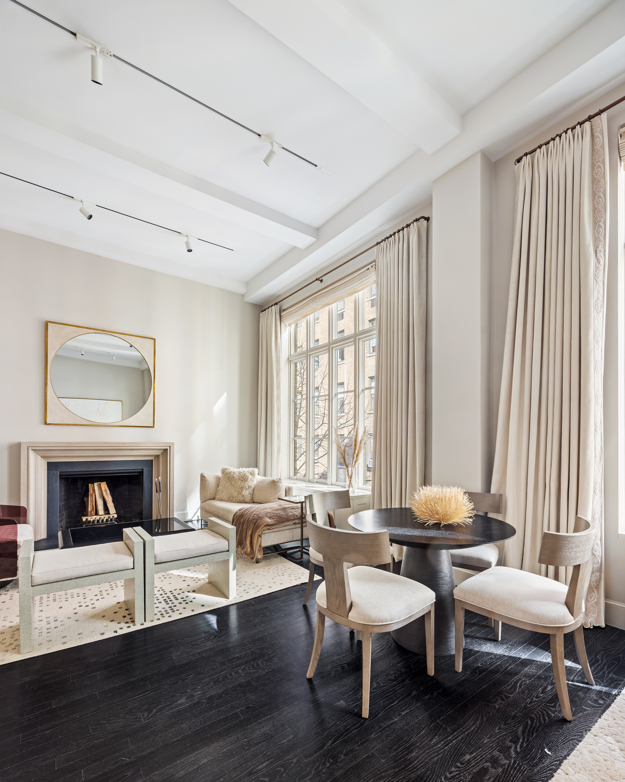 169 East 78th Street, Unit 7C Manhattan, NY 10075 - Photo 11 of 30 a living room with furniture and a fireplace