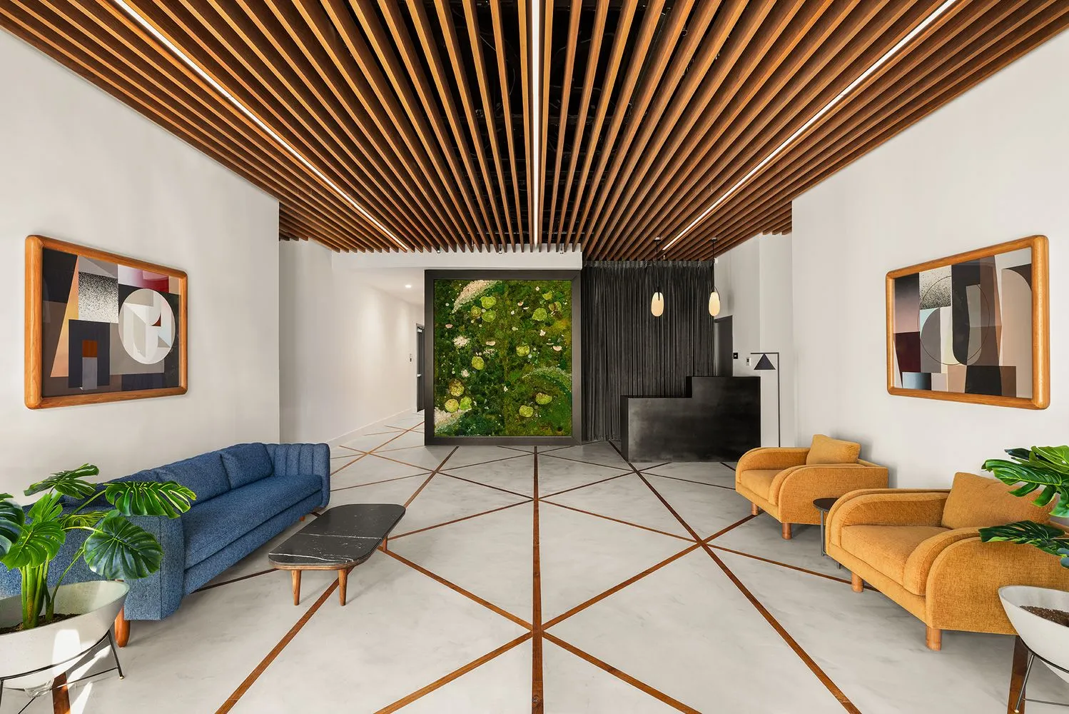 a living room with furniture and a potted plant