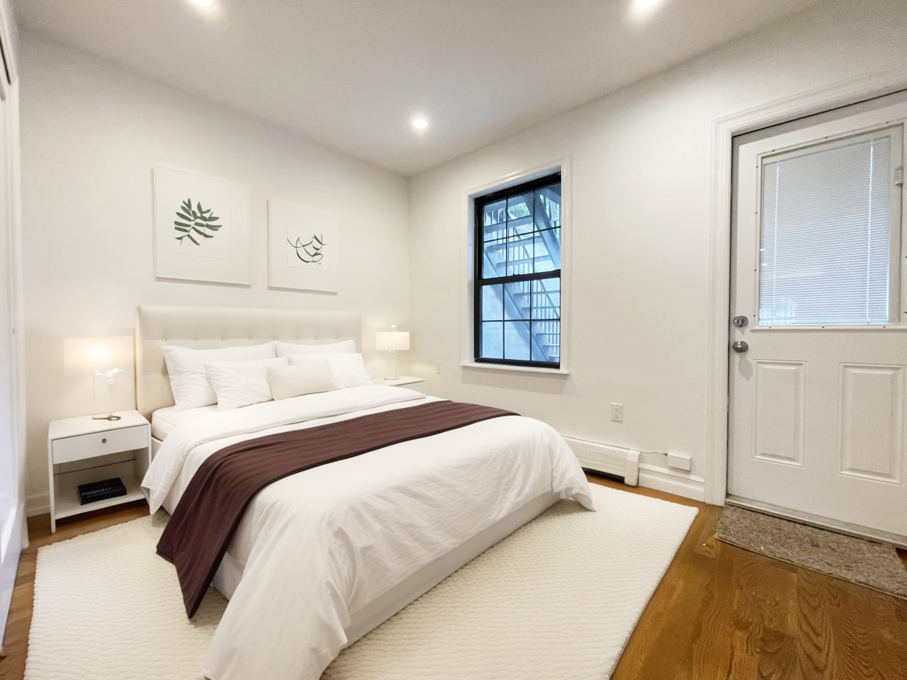 157 Prospect Avenue, Unit 1 Brooklyn, NY 11215 - Photo 3 of 10 a bedroom with a large bed and a window