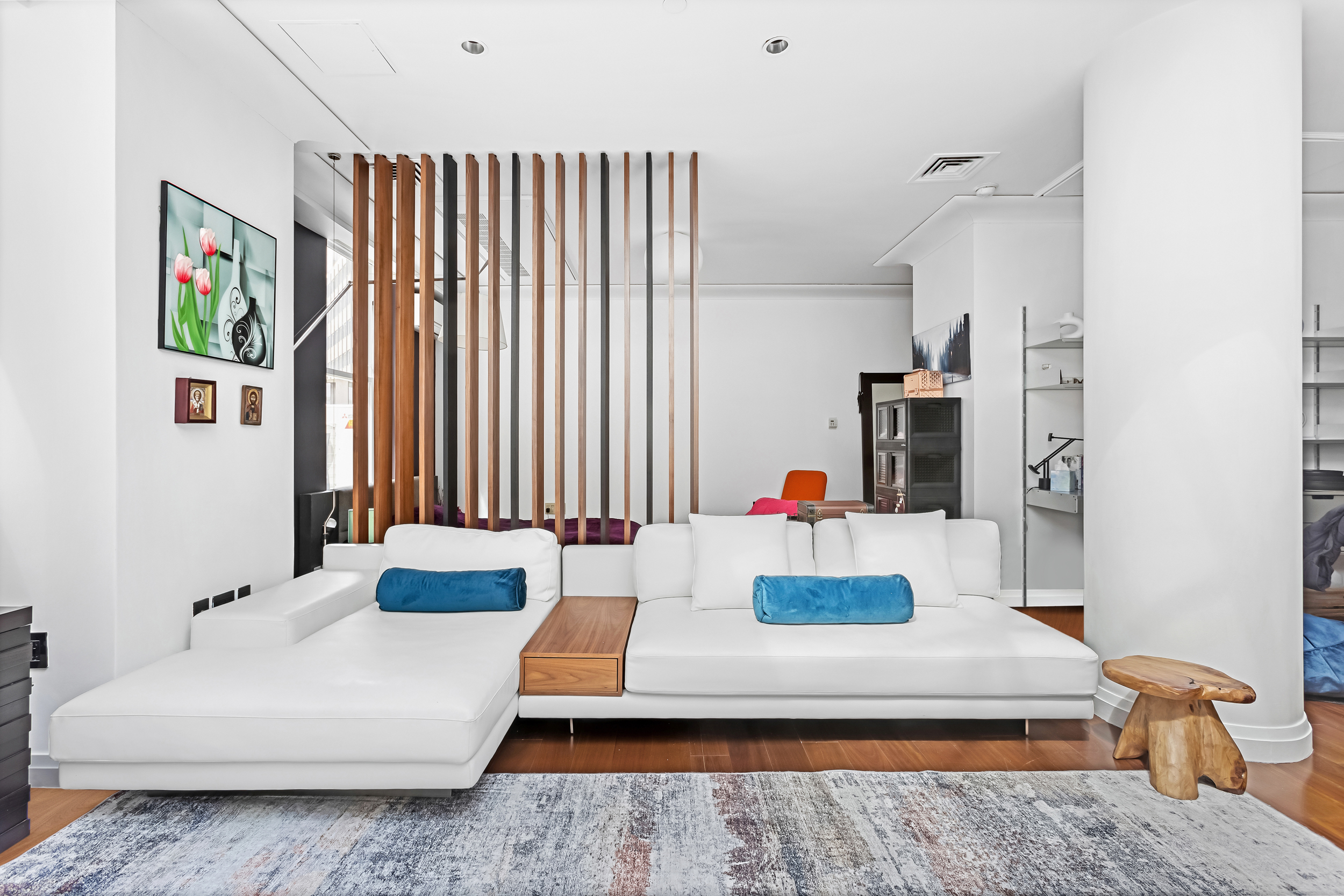 55 Wall Street, Unit PH942 Manhattan, NY 10005 - Photo 3 of 9 a living room with furniture and a table