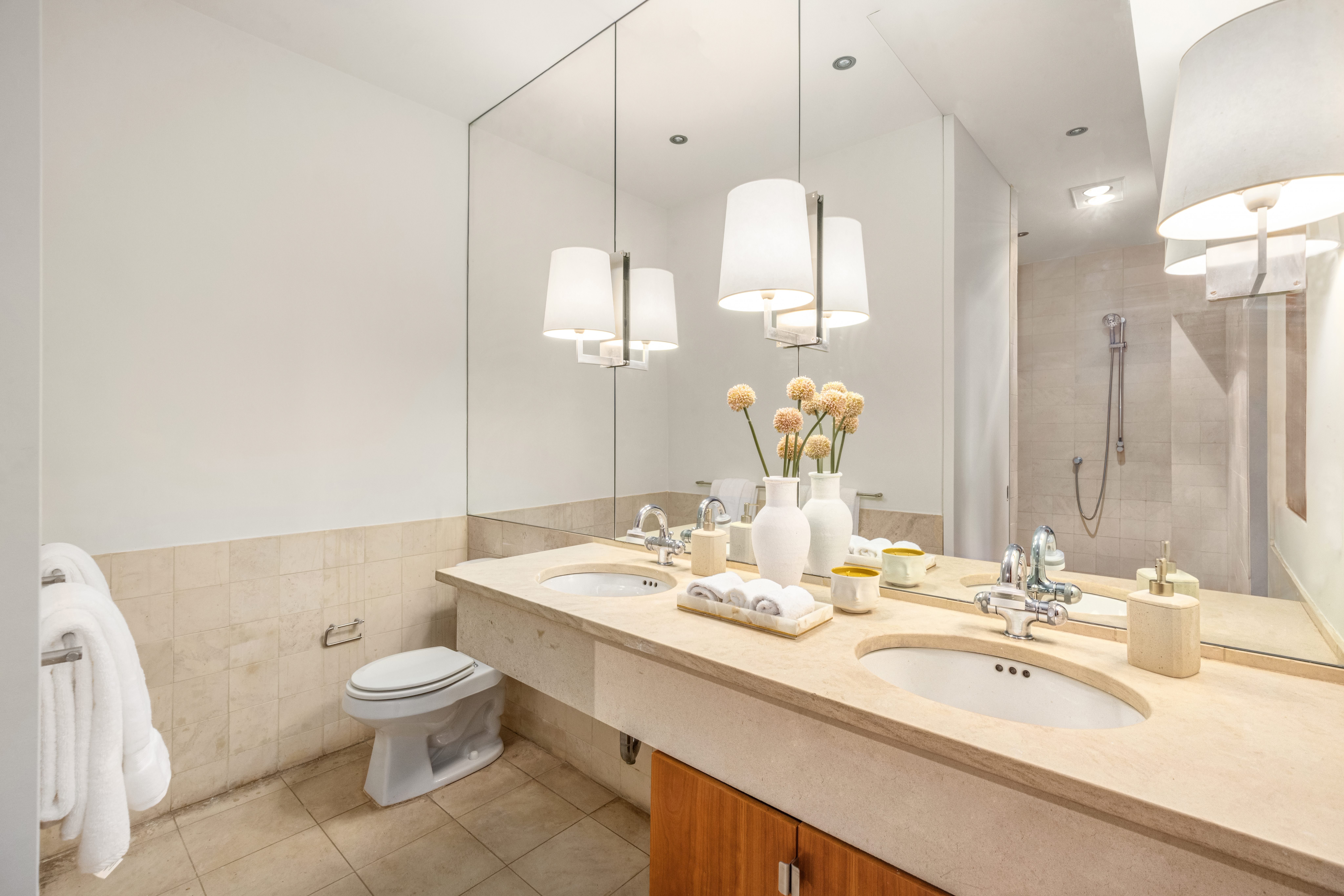 170 5th Avenue, Unit 5 Manhattan, NY 10010 - Photo 16 of 22 a bathroom with a double vanity sink and a mirror