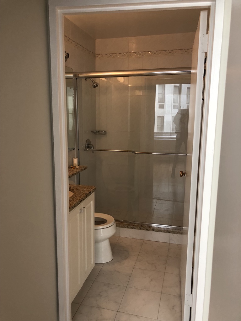 61 West 62nd Street, Unit 7C Manhattan, NY 10023 - Photo 6 of 7 a bathroom with a toilet and a shower