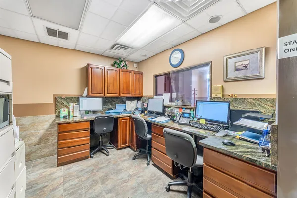 a kitchen with stainless steel appliances granite countertop a sink and a stove