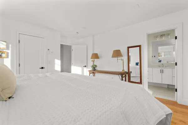 a view of a bedroom with a bed and closet