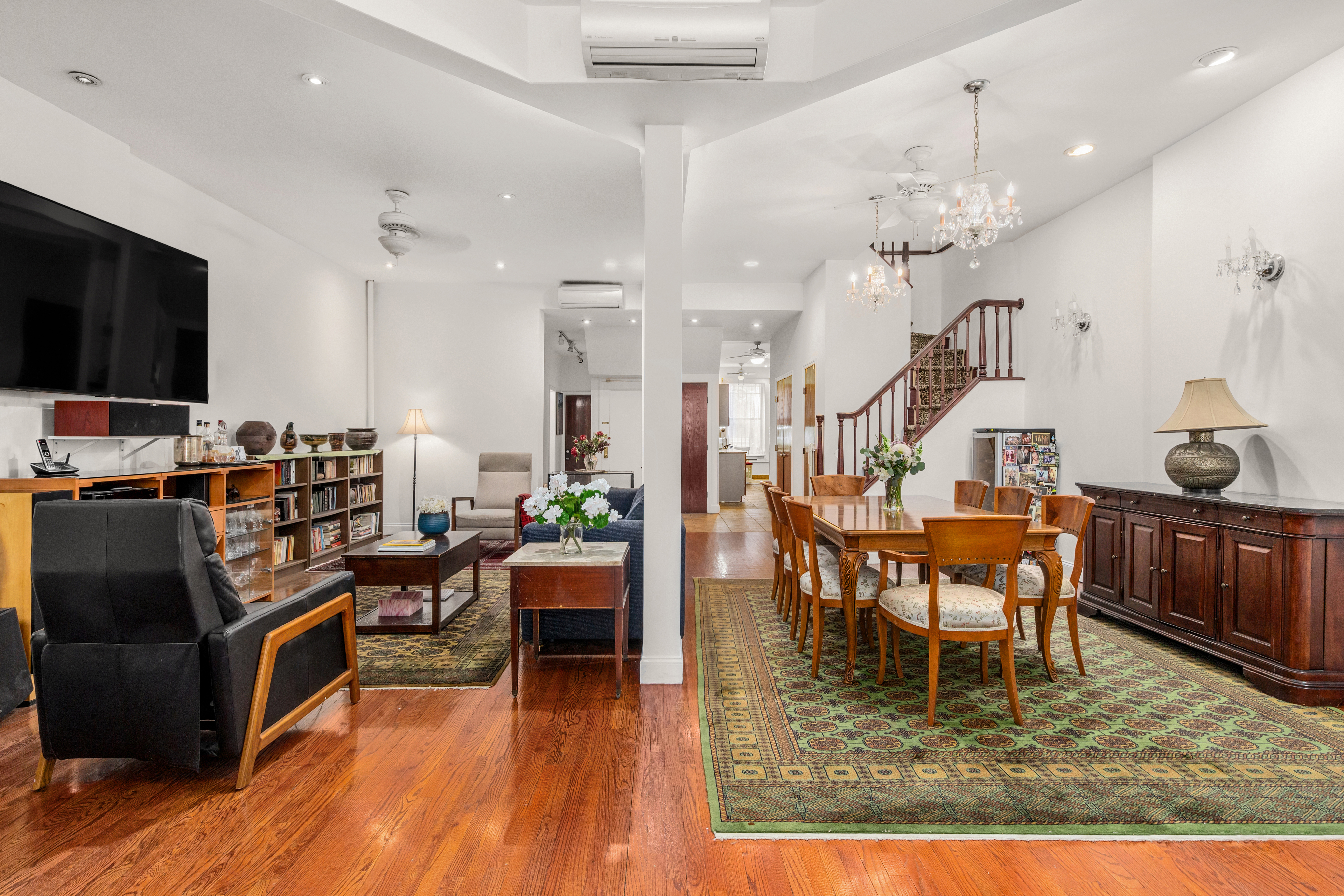 517 East 87th Street, Unit 1 Manhattan, NY 10128 - Photo 2 of 17 a living room with dining room and wooden floor